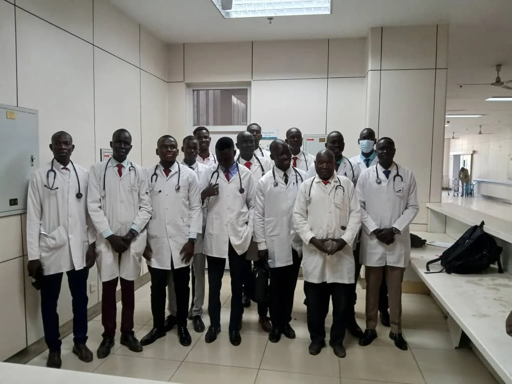 Medical students in white coats during the final professional examination period