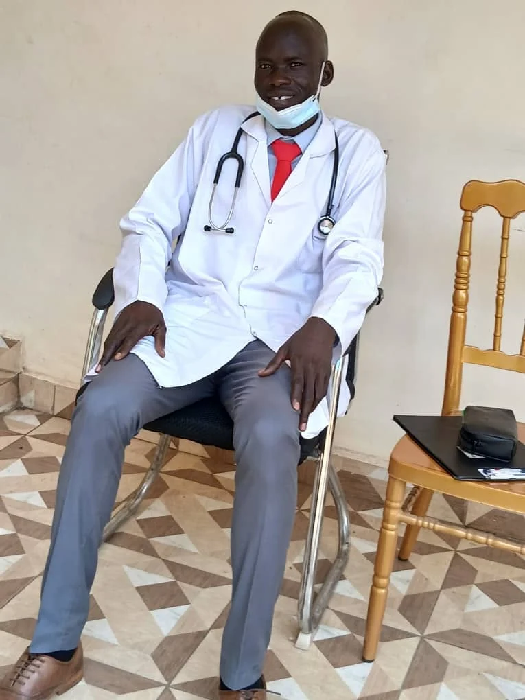 A final-year medical student in clinical attire